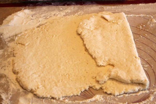 rolling out biscuit dough