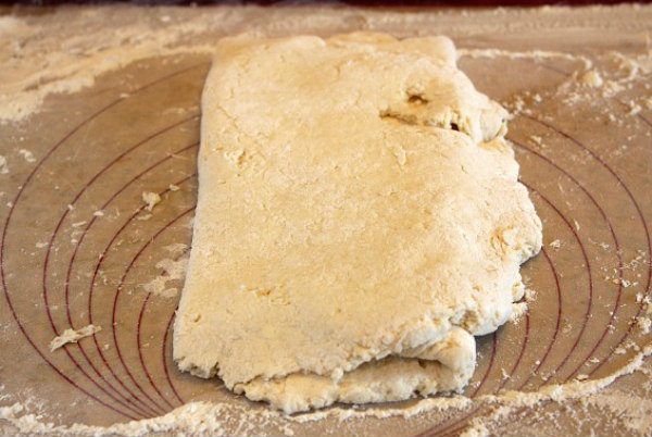 rolling out biscuit dough