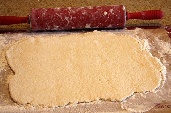 rolling out biscuit dough