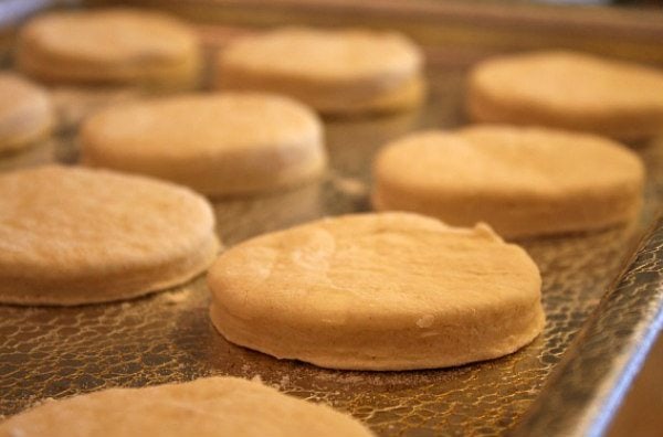 Flaky Buttermilk Biscuits on a baking sheet ready for oven