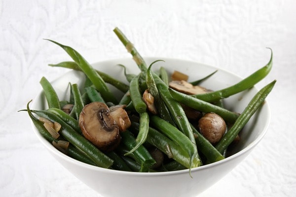 Green Beans with Mushrooms and Shallots in a white bowl