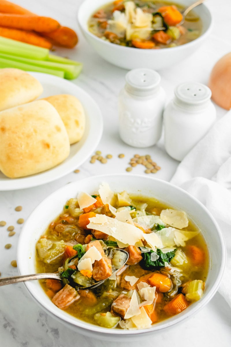 bowl of ham and lentil soup in white bowl