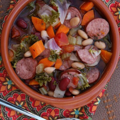 bowl of slow cooker tuscan sausage and bean soup