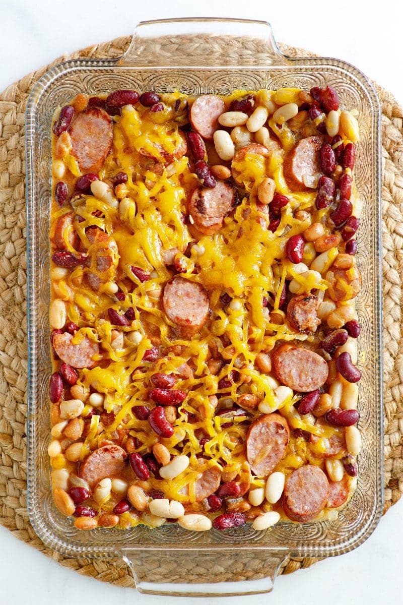 Three Bean and Sausage Bake recipe from RecipeGirl.com #three #3 #bean #beans #sausage #bake #casserole #recipe #weight #watchers #weightwatchers #freestyle #smartpoints #RecipeGirl Three Bean and Sausage Bake in a casserole dish