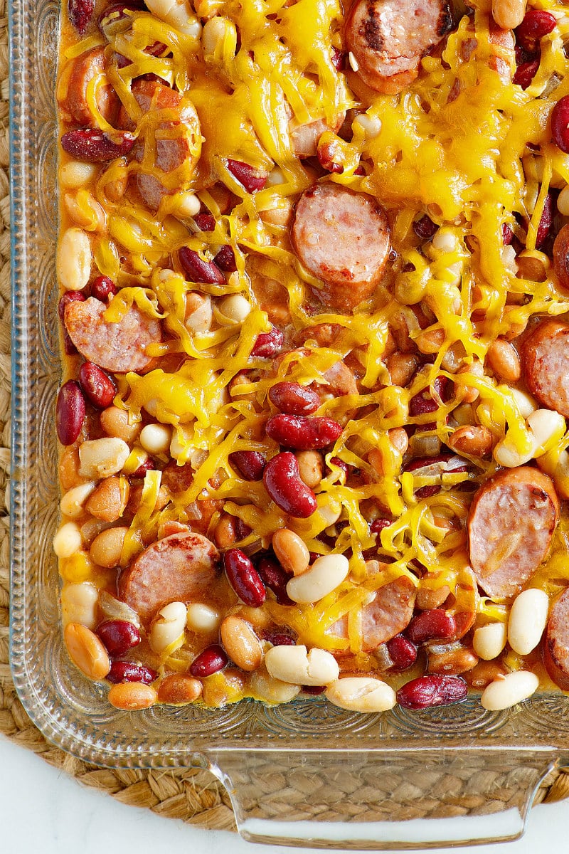 Three Bean and Sausage Bake recipe from RecipeGirl.com #three #3 #bean #beans #sausage #bake #casserole #recipe #weight #watchers #weightwatchers #freestyle #smartpoints #RecipeGirl Three Bean and Sausage Bake in a casserole dish