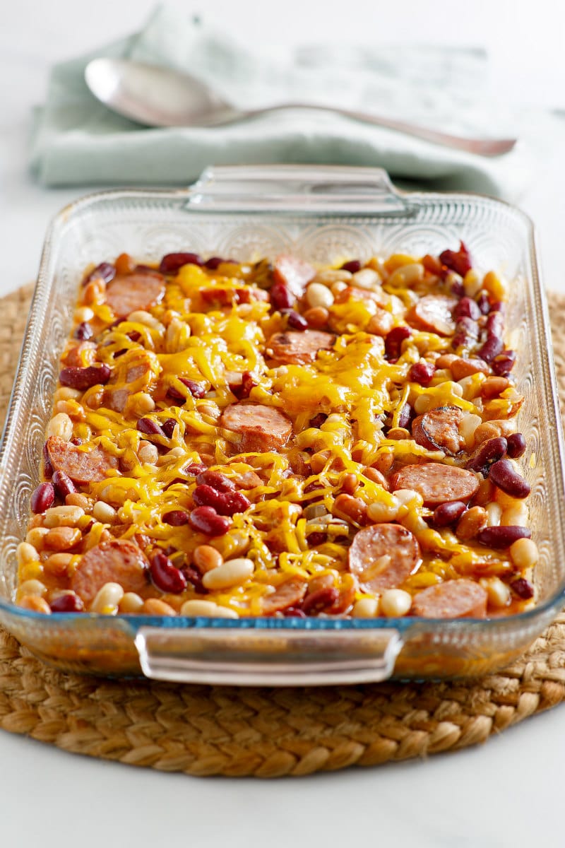 Three Bean and Sausage Bake recipe from RecipeGirl.com #three #3 #bean #beans #sausage #bake #casserole #recipe #weight #watchers #weightwatchers #freestyle #smartpoints #RecipeGirl Three Bean and Sausage Bake in a casserole dish