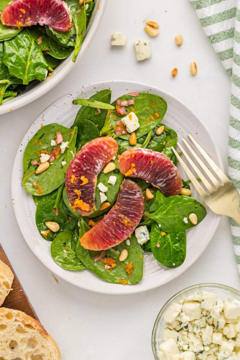 serving of blood orange spinach salad on a plate