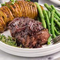 filet mignon with mushroom cabernet sauce on plate