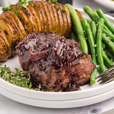 filet mignon with mushroom cabernet sauce on plate