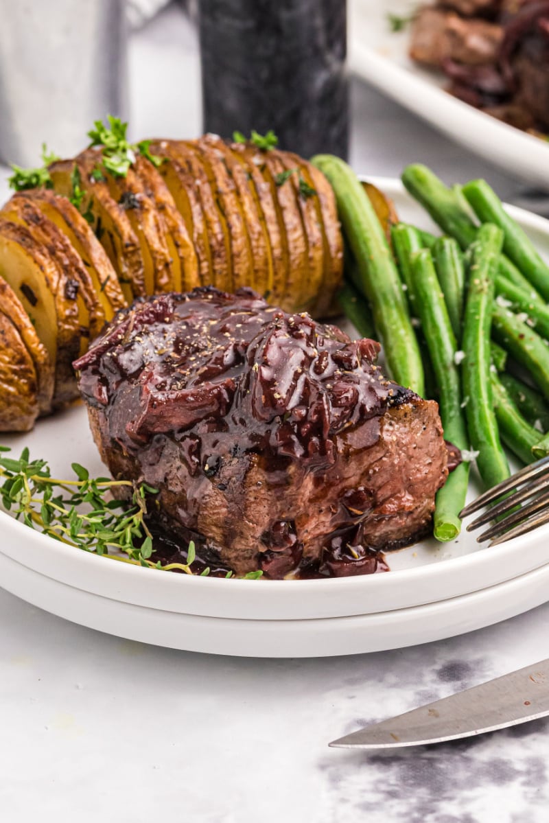 filet mignon with mushroom cabernet sauce on plate