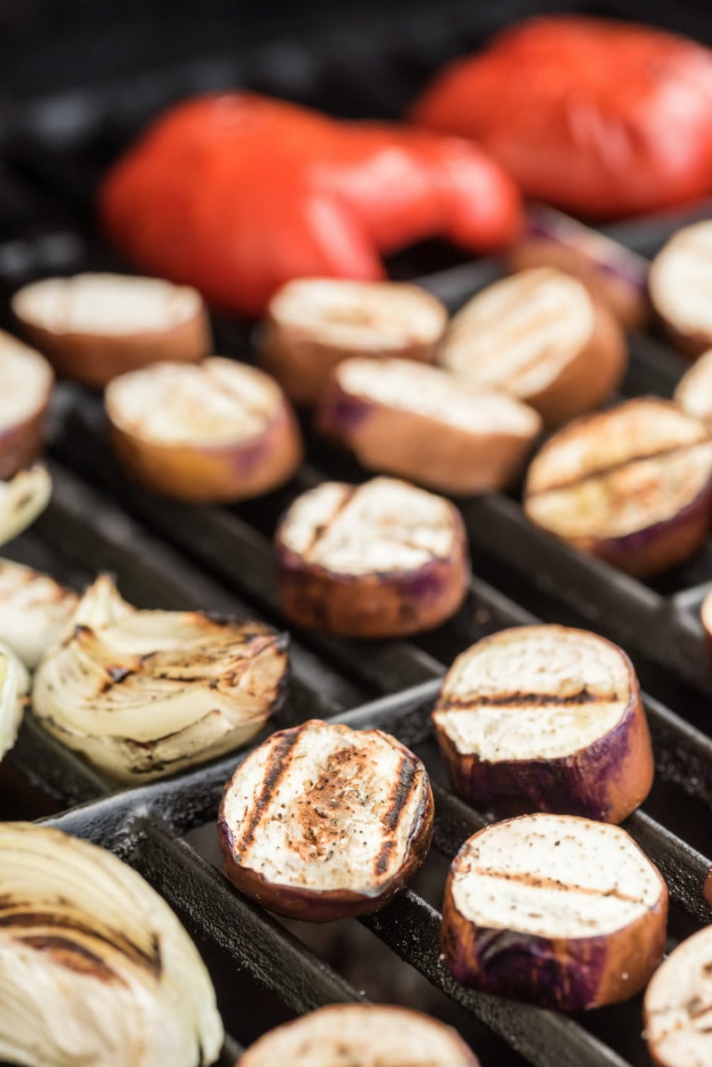 vegetables grilling on the grill- eggplant, onions and red bell peppers