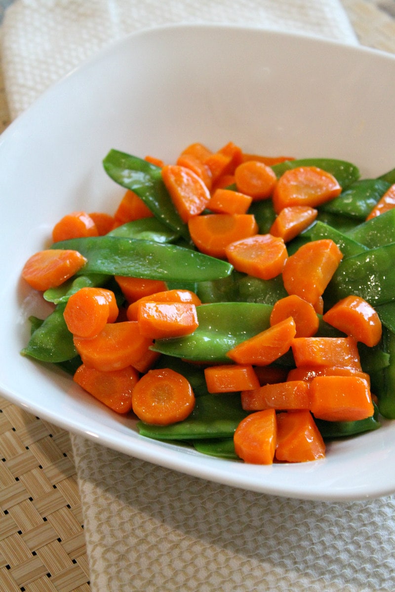 Honey Glazed Pea Pods and Carrots recipe from RecipeGirl.com #honey #glazed #honeyglazed #peapods #carrots #recipe #RecipeGirl Honey Glazed Pea Pods and Carrots