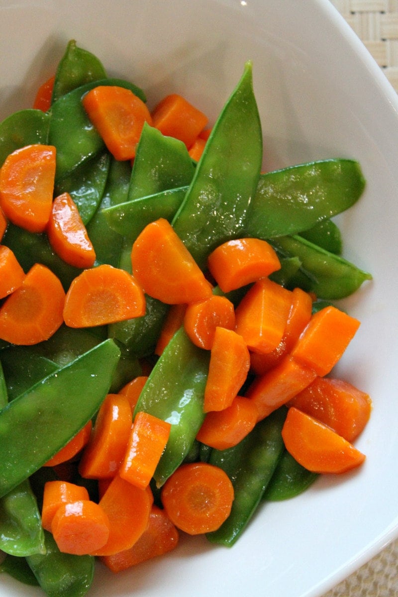 Honey Glazed Pea Pods and Carrots recipe from RecipeGirl.com #honey #glazed #honeyglazed #peapods #carrots #recipe #RecipeGirl Honey Glazed Pea Pods and Carrots