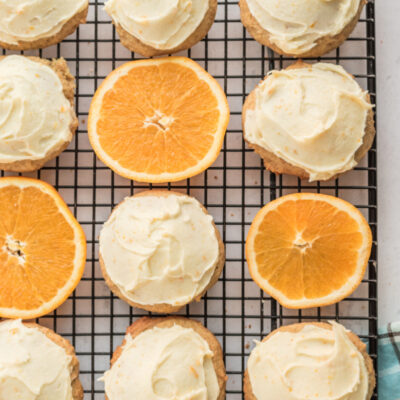 iced orange cookies on cooling rack