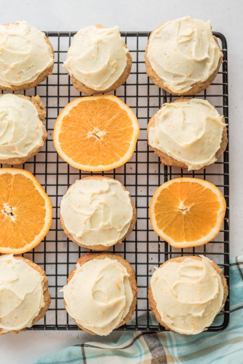 iced orange cookies on cooling rack