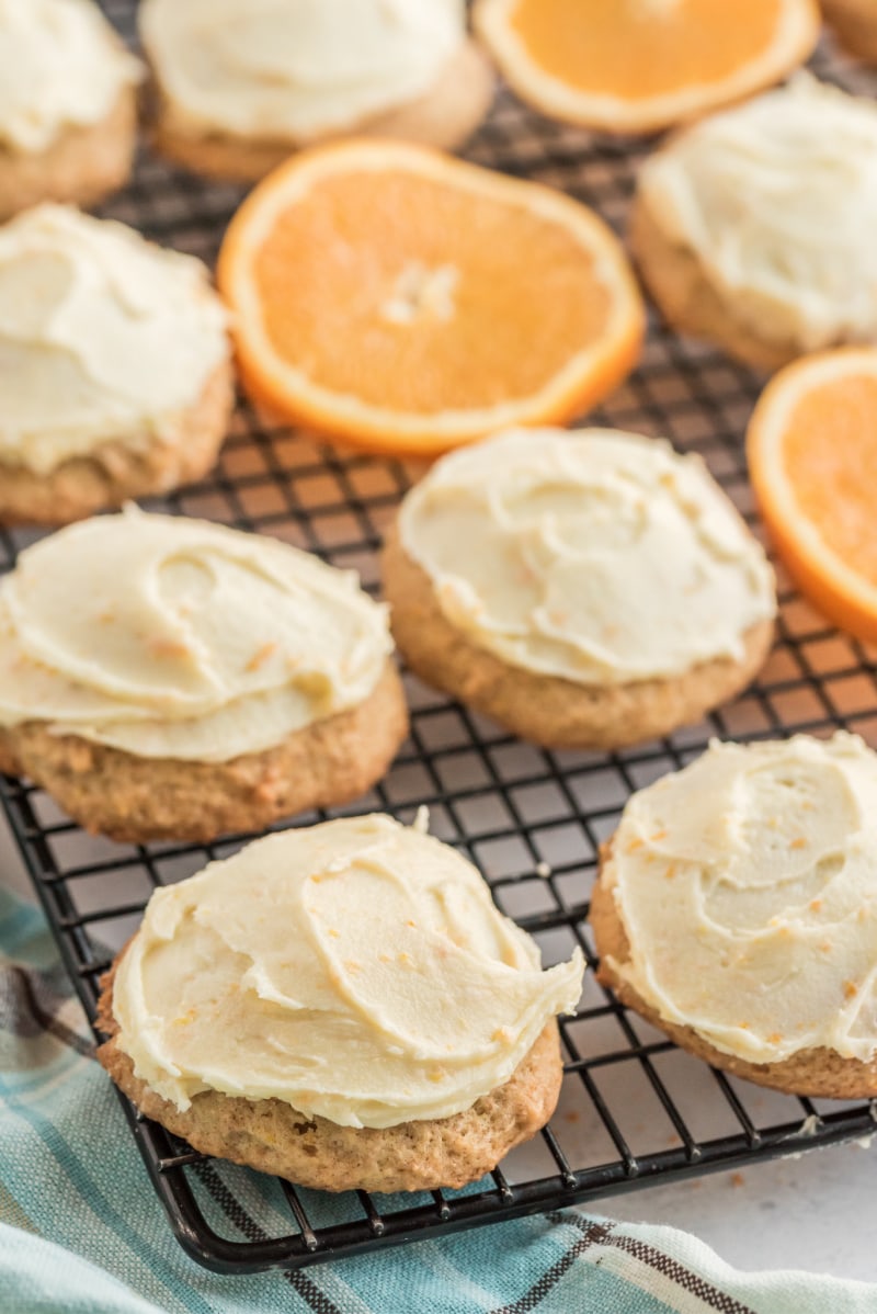 iced orange cookies on a cooling rack