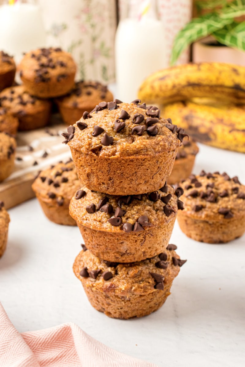 three banana chocolate chip muffins stacked