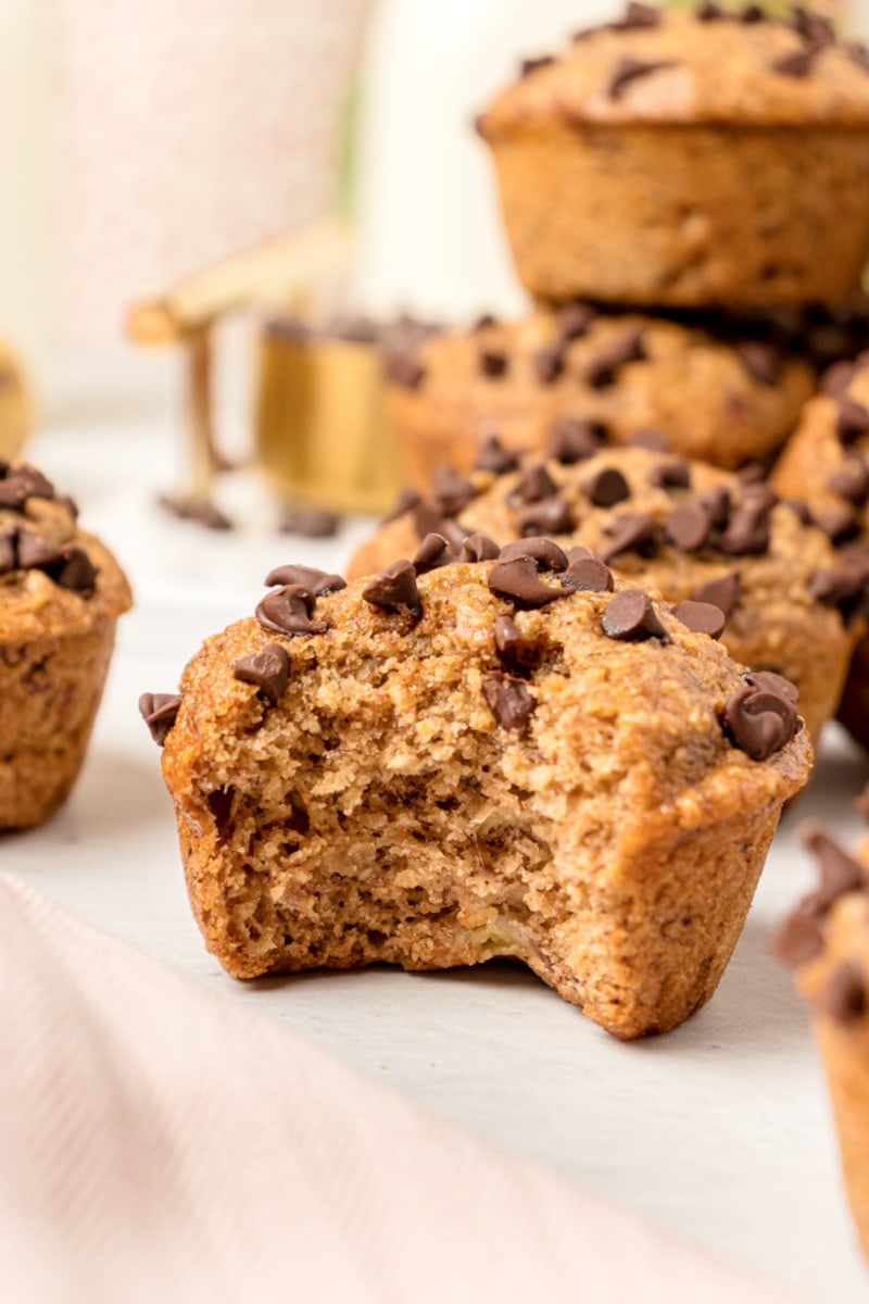 banana chocolate chip muffin with a bite taken out of it