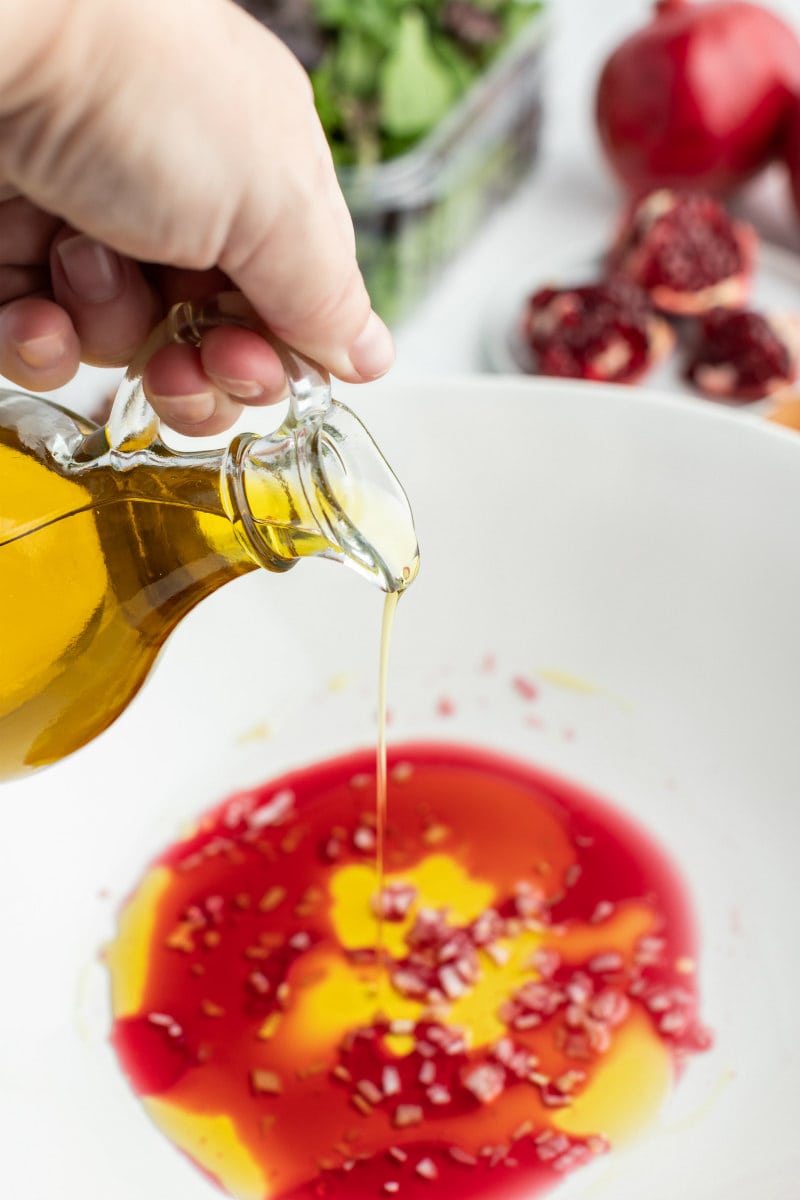 making salad dressing for pomegranate salad