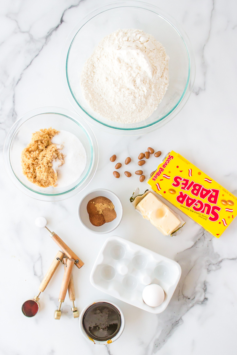 ingredients displayed for making molasses cookies with sugar babies