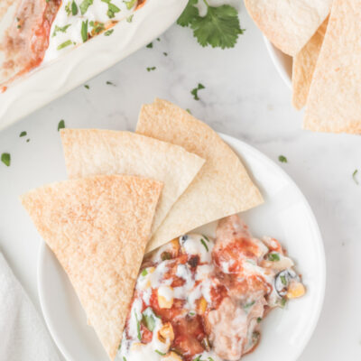 chips and party bean dip on a plate for serving