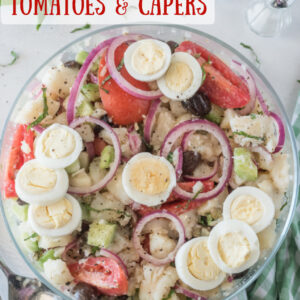 pinterest image for potato salad with olives tomatoes and capers