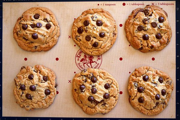 Reeses Stuffed Peanut Butter Chocolate Chip Cookies on a cookie sheet