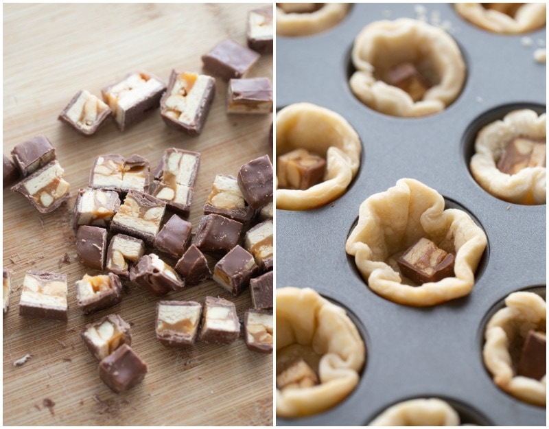 cut up snickers bars and pieces of them in pie dough muffin tin