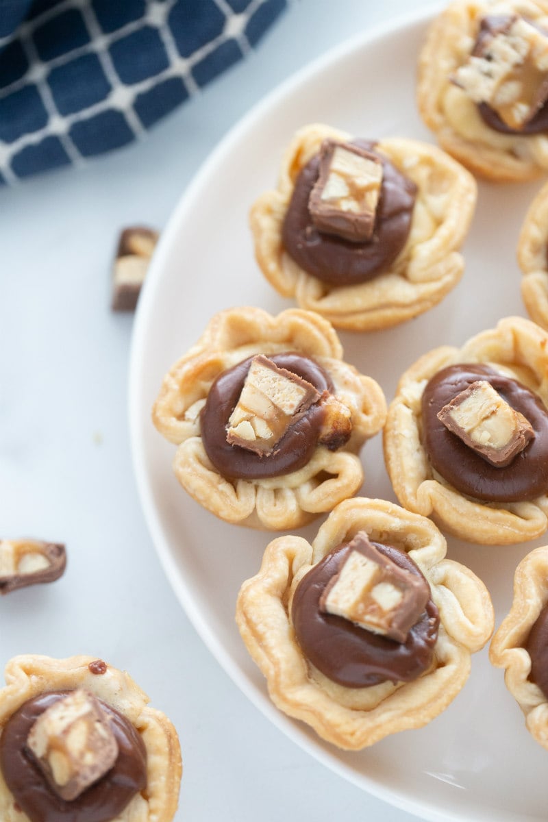 snickers bar mini tarts on white platter