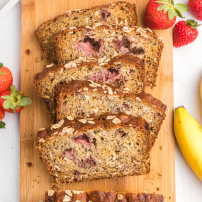slices of strawberry oatmeal banana bread on board