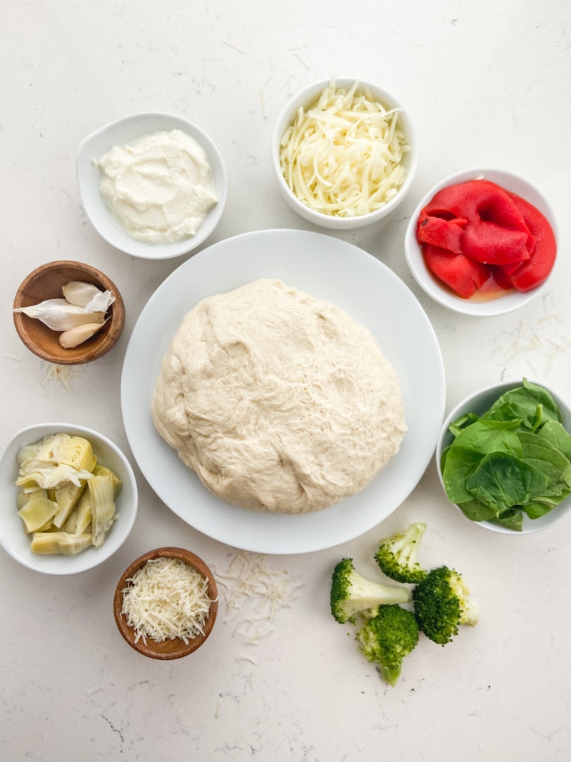ingredients displayed for making stuffed pizza pie