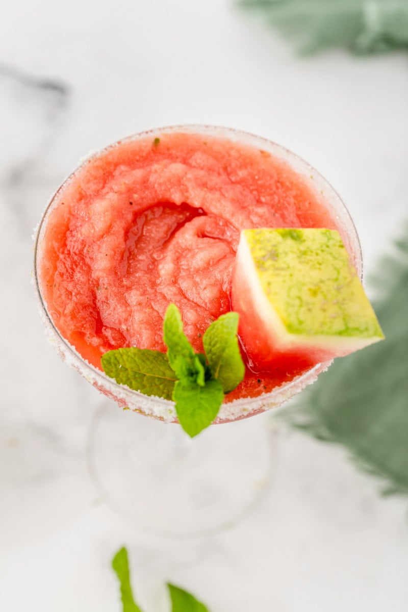 overhead look at watermelon mint margarita garnished with mint and watermelon