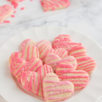 weight watchers heart shaped sugar cookies with pink glaze on platter