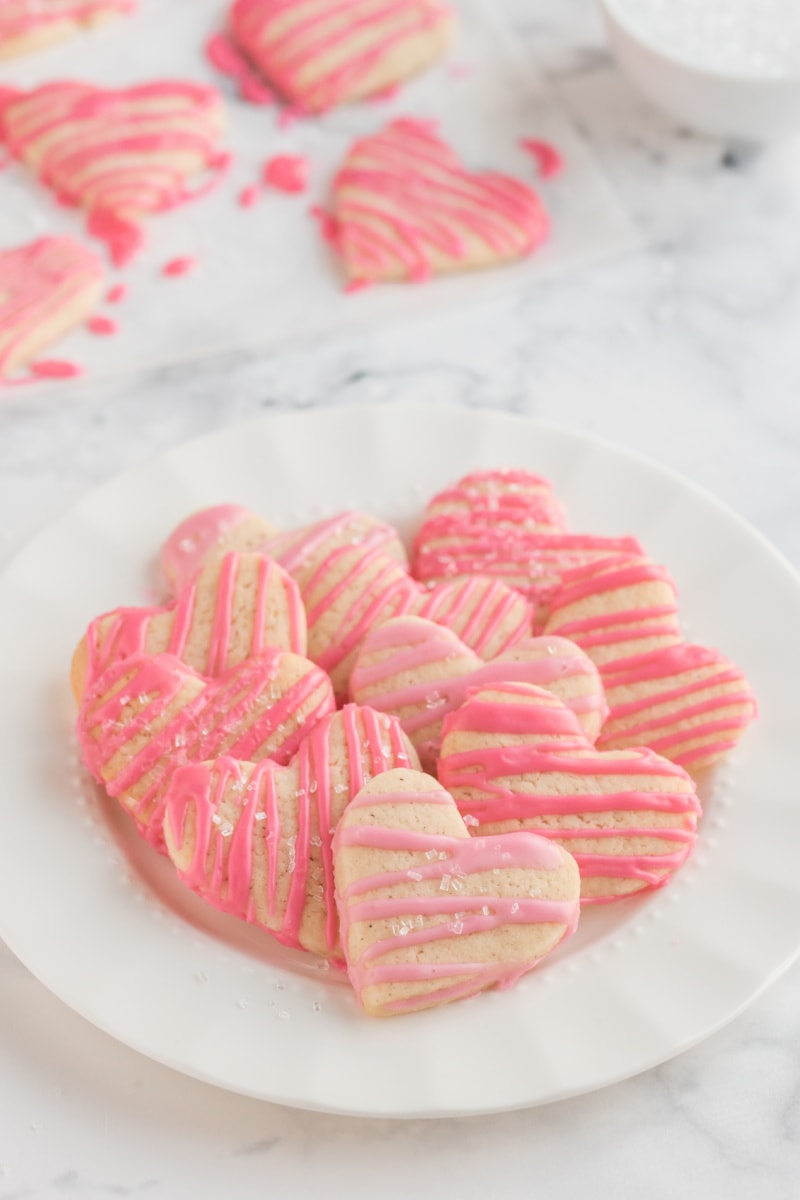 weight watchers heart shaped sugar cookies with pink glaze on platter