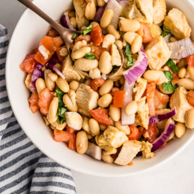 white bowl of white bean and roasted chicken salad