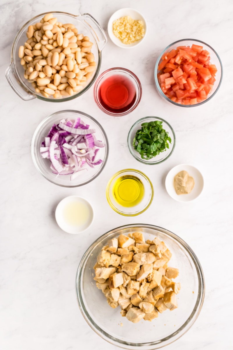 White Bean and Roasted Chicken Salad recipe from RecipeGirl.com #whitebeans #cannellini #beans #roastedchicken #rotisseriechicken #chicken #salad #recipe #RecipeGirl ingredients displayed for making white bean roasted chicken salad
