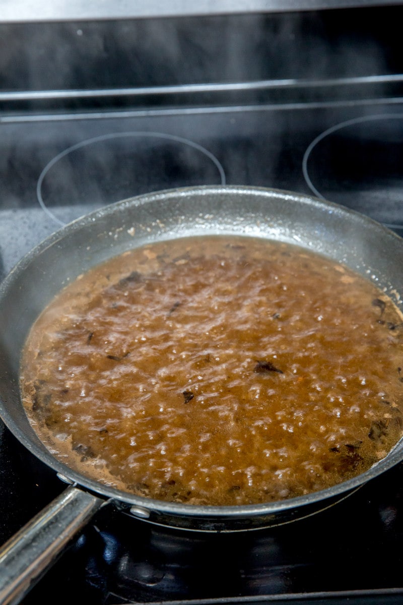 marsala wine sauce bubbling in a skillet