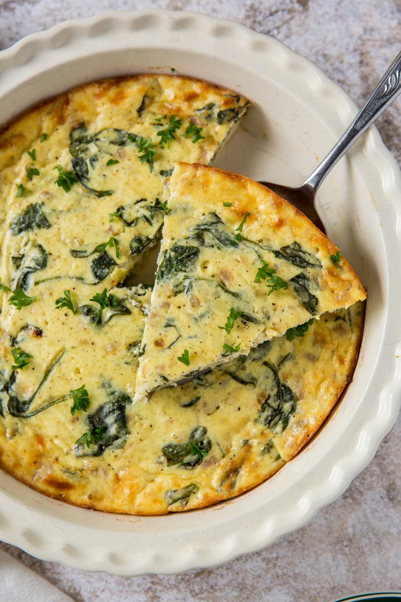 slicing crustless spinach and cheese quiche