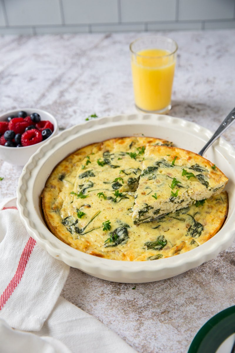 slicing crustless spinach and cheese quiche