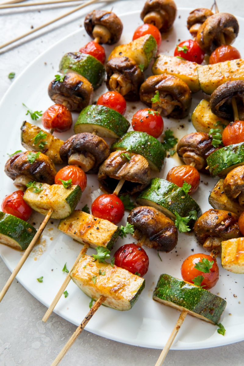 vegetable kabobs on a white platter