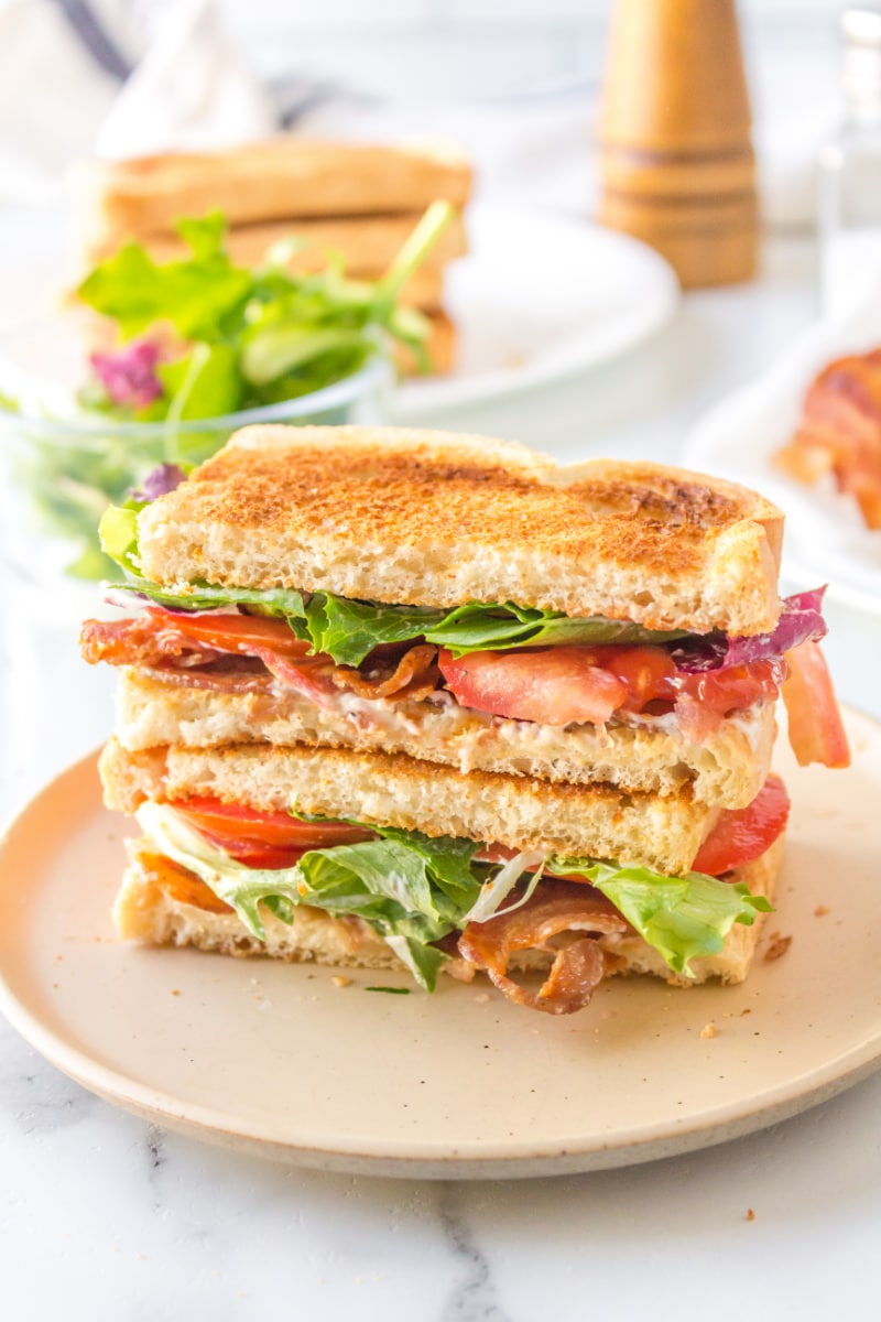blt on plate cut in half stacked