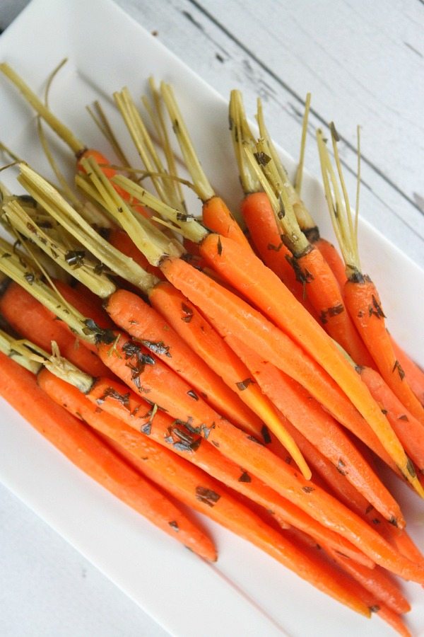 Baby Carrots with Tarragon Baby Carrots with Tarragon on white plate