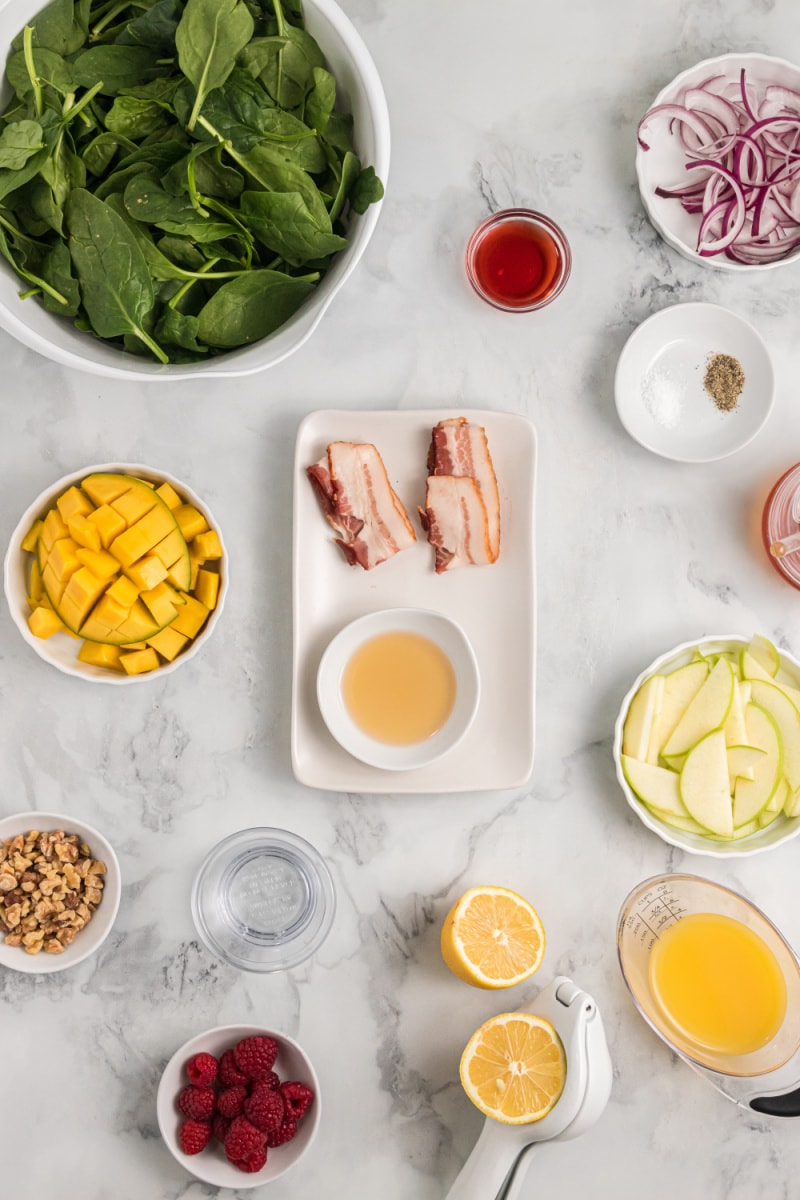 ingredients displayed for making a spinach salad