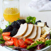 plate of blackberry salad with pork