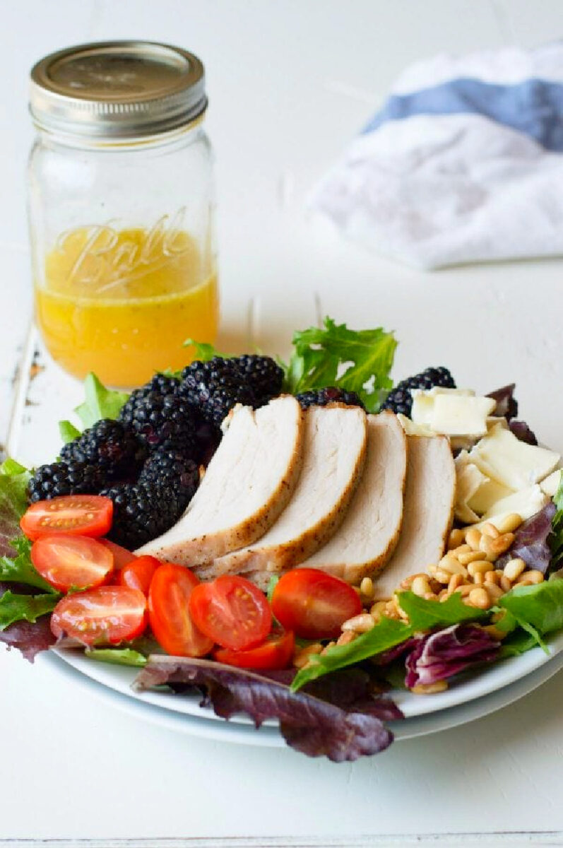 plate of blackberry salad with pork
