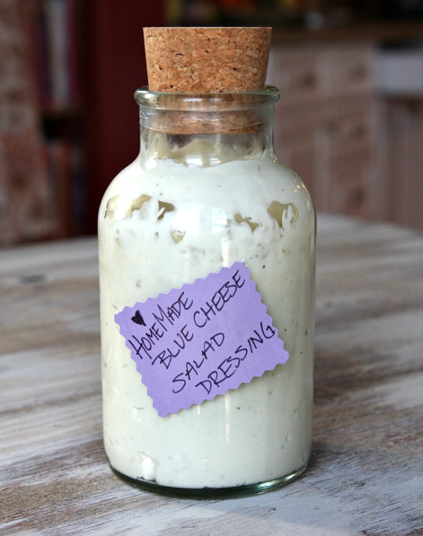 blue cheese salad dressing in a bottle with a cork