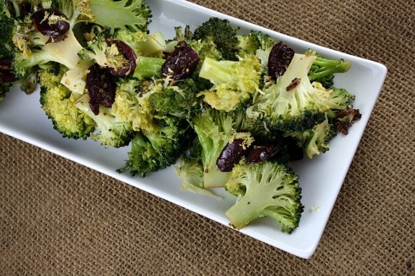 Broccoli with Olives and Garlic Broccoli with Black Olives, Garlic and Lemon on white plate