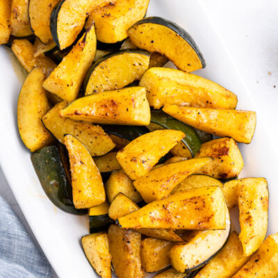 chili roasted acorn squash on white platter