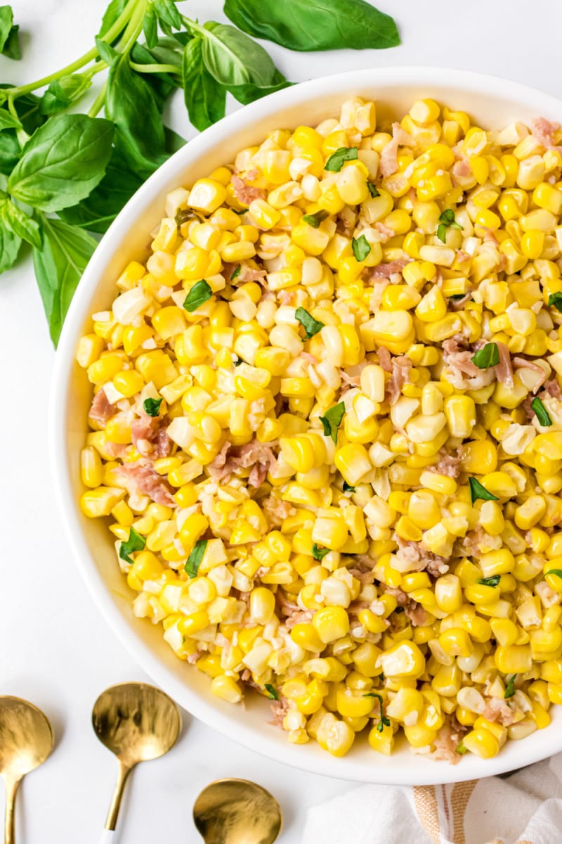 bowl of fresh corn with prosciutto basil butter