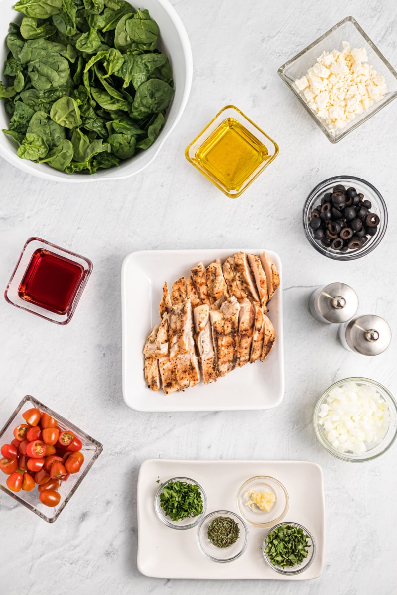 ingredients displayed for making grilled chicken and spinach salad